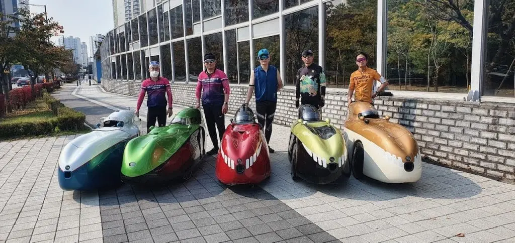 a group of proud velomobile riders