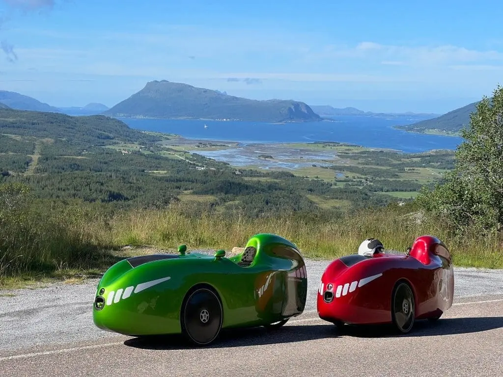 Two Alpha 7 velomobiles in an stunning landscape